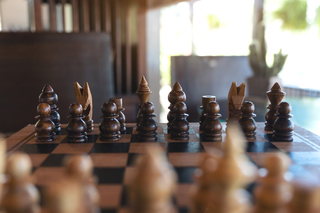 Closeup image of a wooden chess set on chessboard