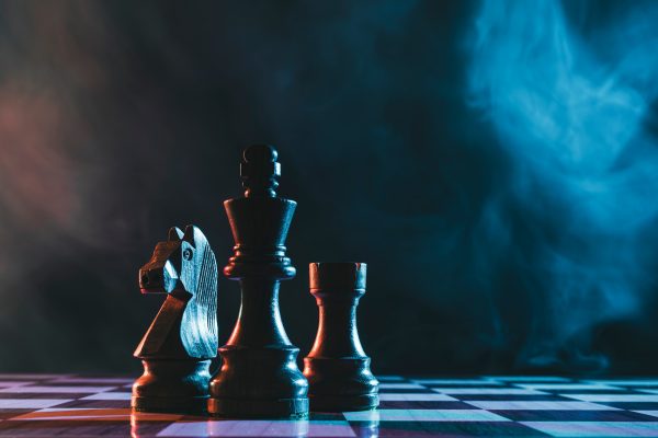 Chess pieces on a dark background